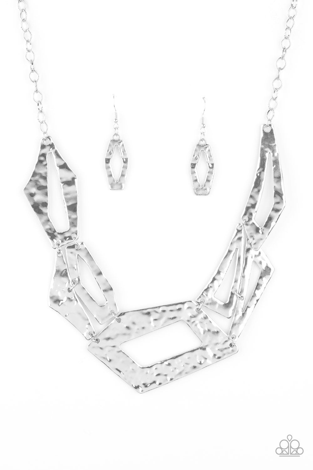 Break The Mold Silver Necklace - Paparazzi Accessories  Attached to an edgy silver chain, hammered silver plates featuring asymmetrical shapes abstractly link below the collar for a knockout look. Features an adjustable clasp closure.  All Paparazzi Accessories are lead free and nickel free!  Sold as one individual necklace. Includes one pair of matching earrings.