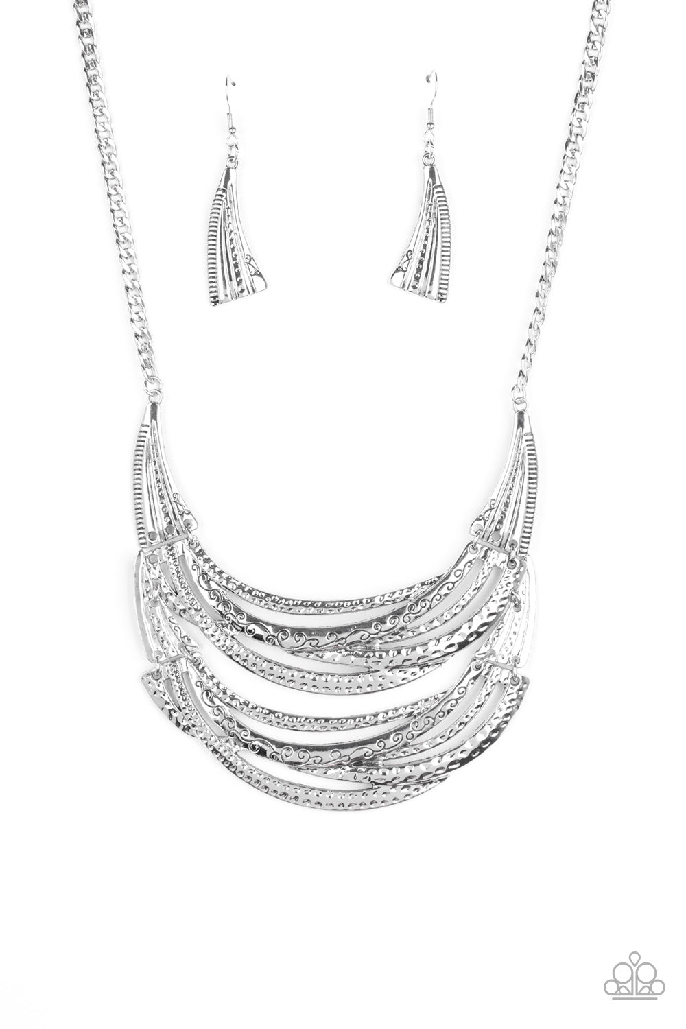 Read Between the VINES Silver Necklace - Paparazzi Accessories Stamped in sections of vine-like patterns, abstract hammered plates and overlapping silver bars link into an exaggerated pendant below the collar for a statement-making look. Features an adjustable clasp closure.  Sold as one individual necklace. Includes one pair of matching earrings.