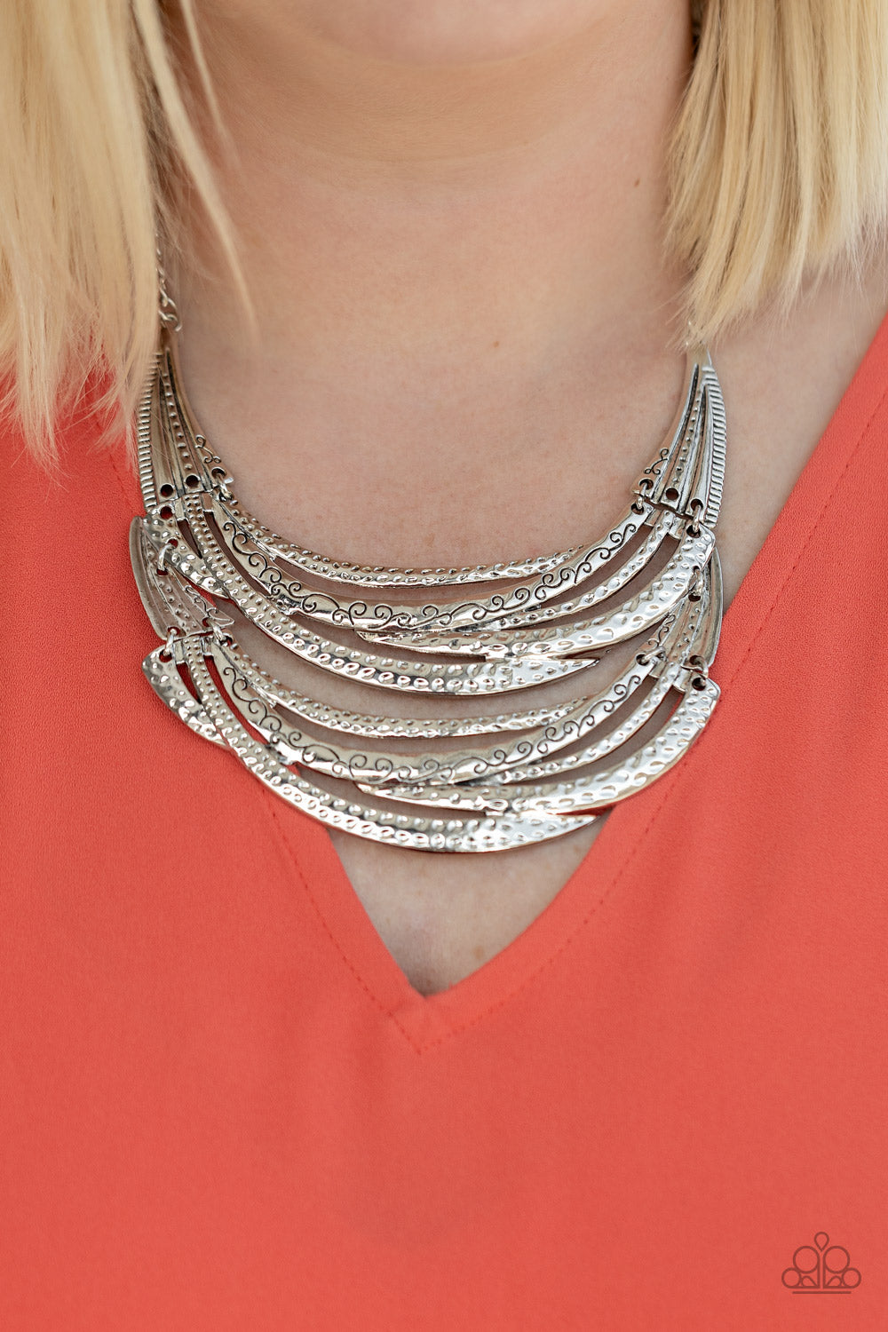 Read Between the VINES Silver Necklace - Paparazzi Accessories Stamped in sections of vine-like patterns, abstract hammered plates and overlapping silver bars link into an exaggerated pendant below the collar for a statement-making look. Features an adjustable clasp closure.  Sold as one individual necklace. Includes one pair of matching earrings.