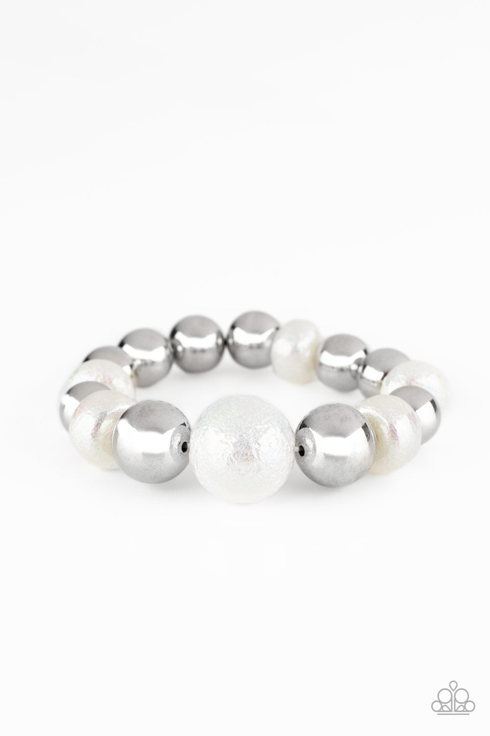 Starstruck Shimmer White Bracelet- Paparazzi Accessories.  Brushed in a stellar iridescence, hammered pearly beads and classic silver beads gradually increase in size as they slide along a stretchy band around the wrist for a glamorous look. All Paparazzi Accessories are lead free and nickel free!  Sold as one individual bracelet.  Get The Complete Look! Necklace: "Twinkle Twinkle, I'm The Star - White" (Sold Separately)