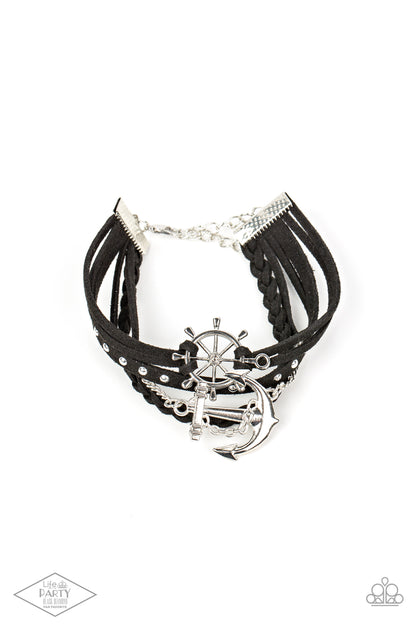 Anchors Away Black Bracelet - Paparazzi Accessories  Braided black leather and a strand of silver studs are complemented by black suede in a boyfriend bracelet style. Gorgeous nautical elements in a classic silver finish add undeniable charm. Features an adjustable clasp closure.  Sold as one individual bracelet. This Fan Favorite is back in the spotlight at the request of our 2021 Life of the Party member with Black Diamond Access, LeCricia S.