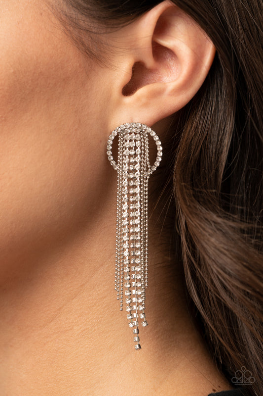 Dazzle by Default White Earring - Paparazzi Accessories  Dainty strands of glassy white rhinestones and shimmery silver ball-chain stream from the top of a bedazzled white rhinestone hoop, creating a dazzling fringe. Earring attaches to a standard post fitting.  All Paparazzi Accessories are lead free and nickel free!  Sold as one pair of post earrings.