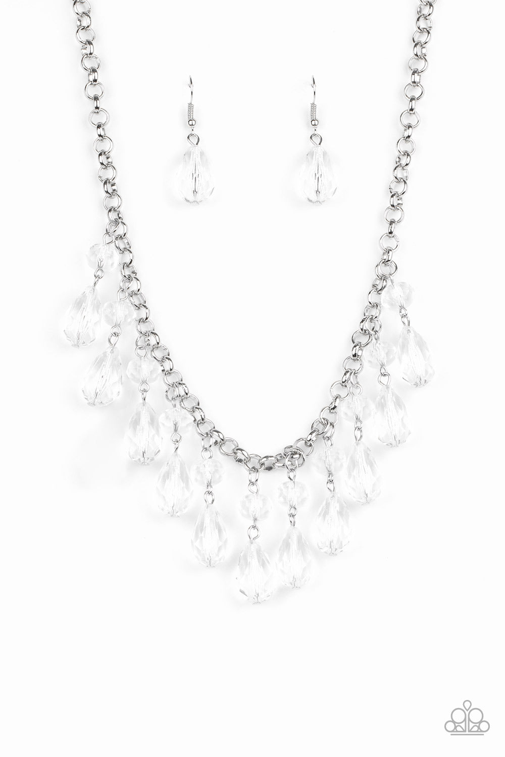 Crystal Enchantment White Necklace - Paparazzi Accessories  Featuring round and teardrop cuts, white crystal-like tassels dangle from the bottom of a shimmery silver chain, creating an enchanting fringe below the collar. Features an adjustable clasp closure. All Paparazzi Accessories are lead free and nickel free!  Sold as one individual necklace. Includes one pair of matching earrings.