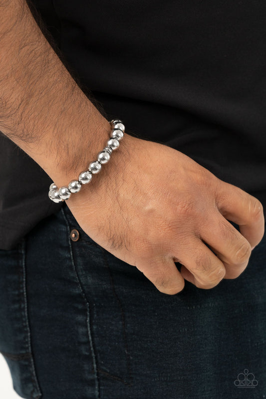 Resilience Silver Urban Bracelet - Paparazzi Accessories  Infused with dainty silver accent pieces, a collection of oversized silver beads are threaded along a stretchy band around the wrist for a causally urban look.  All Paparazzi Accessories are lead free and nickel free!  Sold as one individual bracelet.