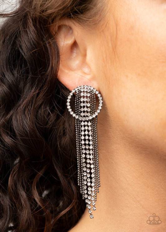 Dazzle by Default Black Earring - Paparazzi Accessories  Dainty strands of glassy white rhinestones and shimmery gunmetal ball-chain stream from the top of a bedazzled white rhinestone hoop, creating a dazzling fringe. Earring attaches to a standard post fitting.  ﻿All Paparazzi Accessories are lead free and nickel free!  Sold as one pair of post earrings.
