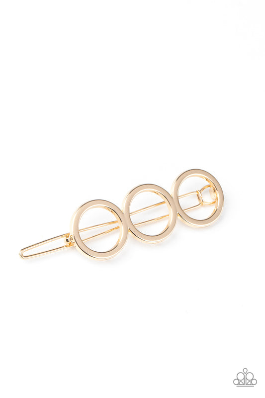 A HOLE Lot of Trouble Gold Hair Clip - Paparazzi Accessories  A trio of gold rings delicately connect into an airy minimalist inspired frame. Features a clamp barrette closure. All Paparazzi Accessories are lead free and nickel free!  Sold as one individual hair clip.
