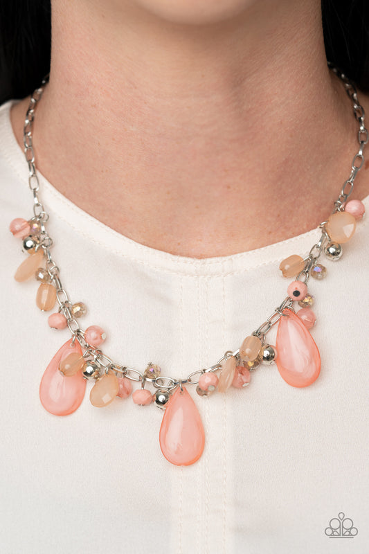 Seaside Solstice Pink Necklace - Paparazzi Accessories.  Featuring classic round and tranquil teardrop shapes, a glassy and opaque collection of Rose Tan, Peach Nougat, silver, and iridescent beads swing from a shimmery silver chain below the collar, creating an enchanting fringe. Features an adjustable clasp closure. All Paparazzi Accessories are lead free and nickel free!  Sold as one individual necklace. Includes one pair of matching earrings.
