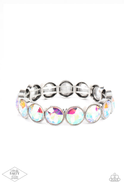 Number One Knockout Multi Bracelet - Paparazzi Accessories  Faceted iridescent gems are pressed into sleek silver frames. The glittery frames are threaded along stretchy bands, creating a glamorous look around the wrist.  All Paparazzi Accessories are lead free and nickel free!  Sold as one individual bracelet.