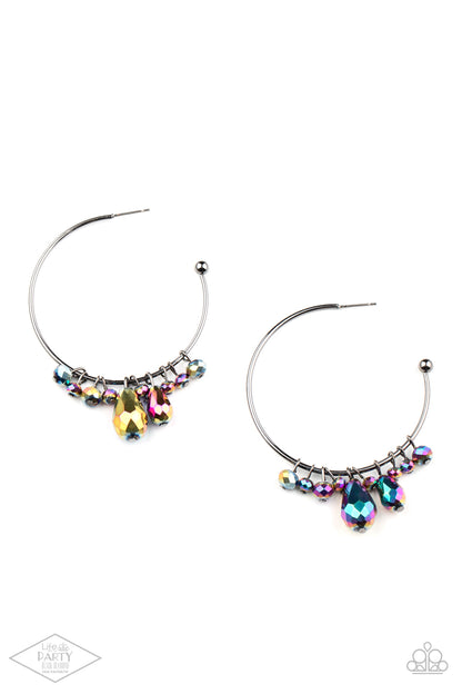 Dazzling Downpour Multi Hoop Earring - Paparazzi Accessories  Featuring an oil spill shimmer, a collection of round and teardrop crystal-like beads slide along a dainty gunmetal hoop for a modern twist. Earring attaches to a standard post fitting. Hoop measures approximately 2" in diameter.  Sold as one pair of hoop earrings. This Fan Favorite is back in the spotlight at the request of our 2021 Life of the Party member with Black Diamond Access, Morgan H.
