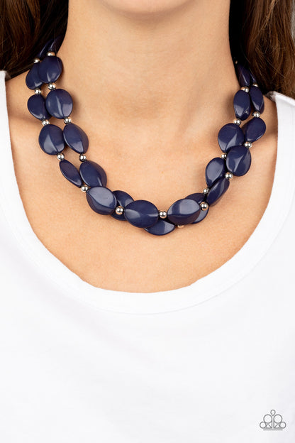 Two-Story Stunner Blue Necklace - Paparazzi Accessories. Two rows of dainty silver beads and faceted Blue Depths faux stone beads alternate along invisible wires below the collar, creating bold, colorful layers. Features an adjustable clasp closure.  All Paparazzi Accessories are lead free and nickel free!   Sold as one individual necklace. Includes one pair of matching earrings.
