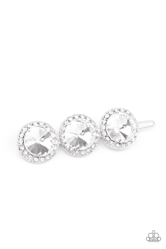 SPOTLIGHT It Up White Hair Clip - Paparazzi Accessories  Encrusted in glassy white rhinestones, a trio of oversized white gems coalesce into a blinding centerpiece. Features a clamp barrette closure.  Sold as one individual hair clip.