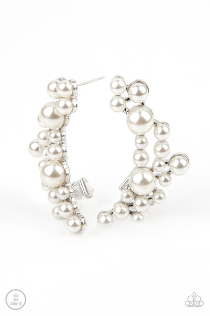 Metro Makeover White Ear Crawler Earring - Paparazzi Accessories A collection of bubbly white pearls dot a shiny silver frame that branches up the ear for a modern, timeless twist. Earring attaches to a standard post fitting. Features a clip-on fitting at the top for a secure fit. ﻿All Paparazzi Accessories are lead free and nickel free! Sold as one pair of ear crawlers.