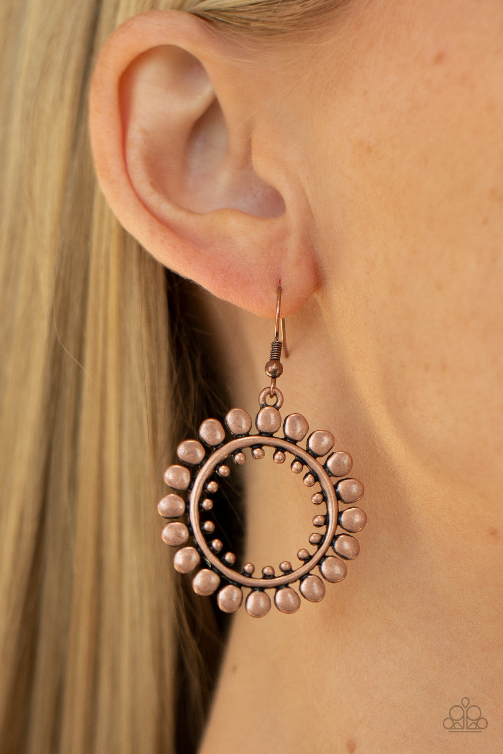 Radiating Radiance - Copper Item #P5SE-CPXX-096XX Asymmetrical copper discs flare out from an antiqued copper ring featuring an airy copper studded center, creating a radiant hoop. Earring attaches to a standard fishhook fitting.  Sold as one pair of earrings.