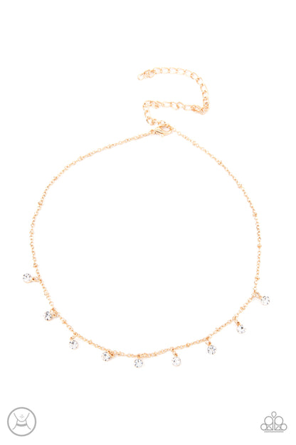 Dainty Diva Gold Choker Necklace - Paparazzi Accessories  Glassy white rhinestones swing from a dainty gold chain, creating a glamorous fringe around the neck. Features an adjustable clasp closure.  All Paparazzi Accessories are lead free and nickel free!  Sold as one individual choker necklace. Includes one pair of matching earrings.
