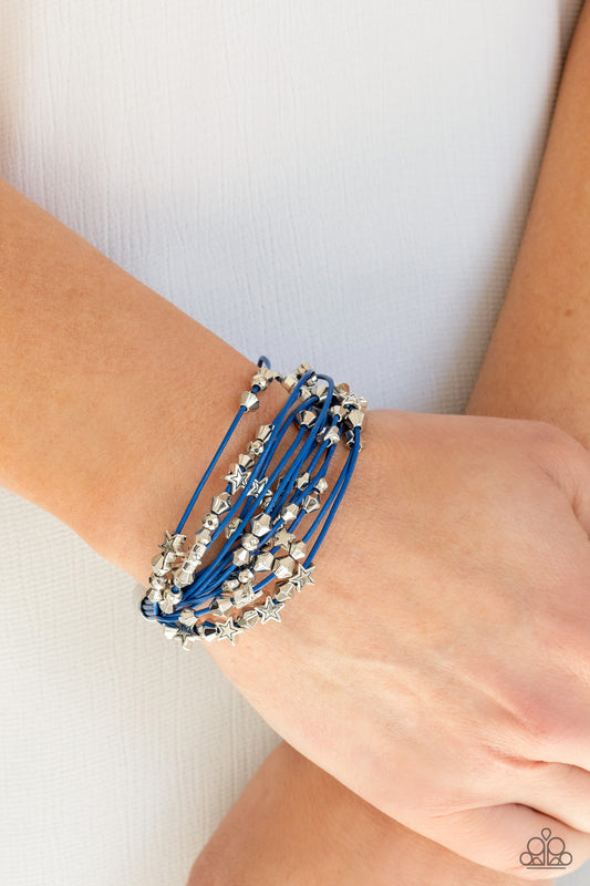 Star-Studded Affair Blue Bracelet - Paparazzi Accessories  A collection of faceted silver beads and silver star charms slides along French Blue cords that layer across the wrist for a colorful look. Features a magnetic closure.  ﻿All Paparazzi Accessories are lead free and nickel free!  Sold as one individual bracelet.