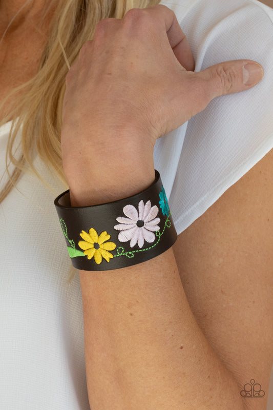 Western Eden Multi Wrap Bracelet - Paparazzi Accessories  A colorful floral pattern is embroidered across the front of a brown leather band, creating a whimsical centerpiece around the wrist. Features an adjustable snap closure.  All Paparazzi Accessories are lead free and nickel free!  Sold as one individual bracelet.