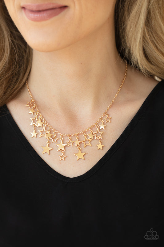 Stellar Stardom Gold Necklace - Paparazzi Accessories  A mismatched collection of shiny gold stars cascade from a dainty gold chain, creating a stellar fringe below the collar. Features an adjustable clasp closure.  ﻿All Paparazzi Accessories are lead free and nickel free!  Sold as one individual necklace. Includes one pair of matching earrings.
