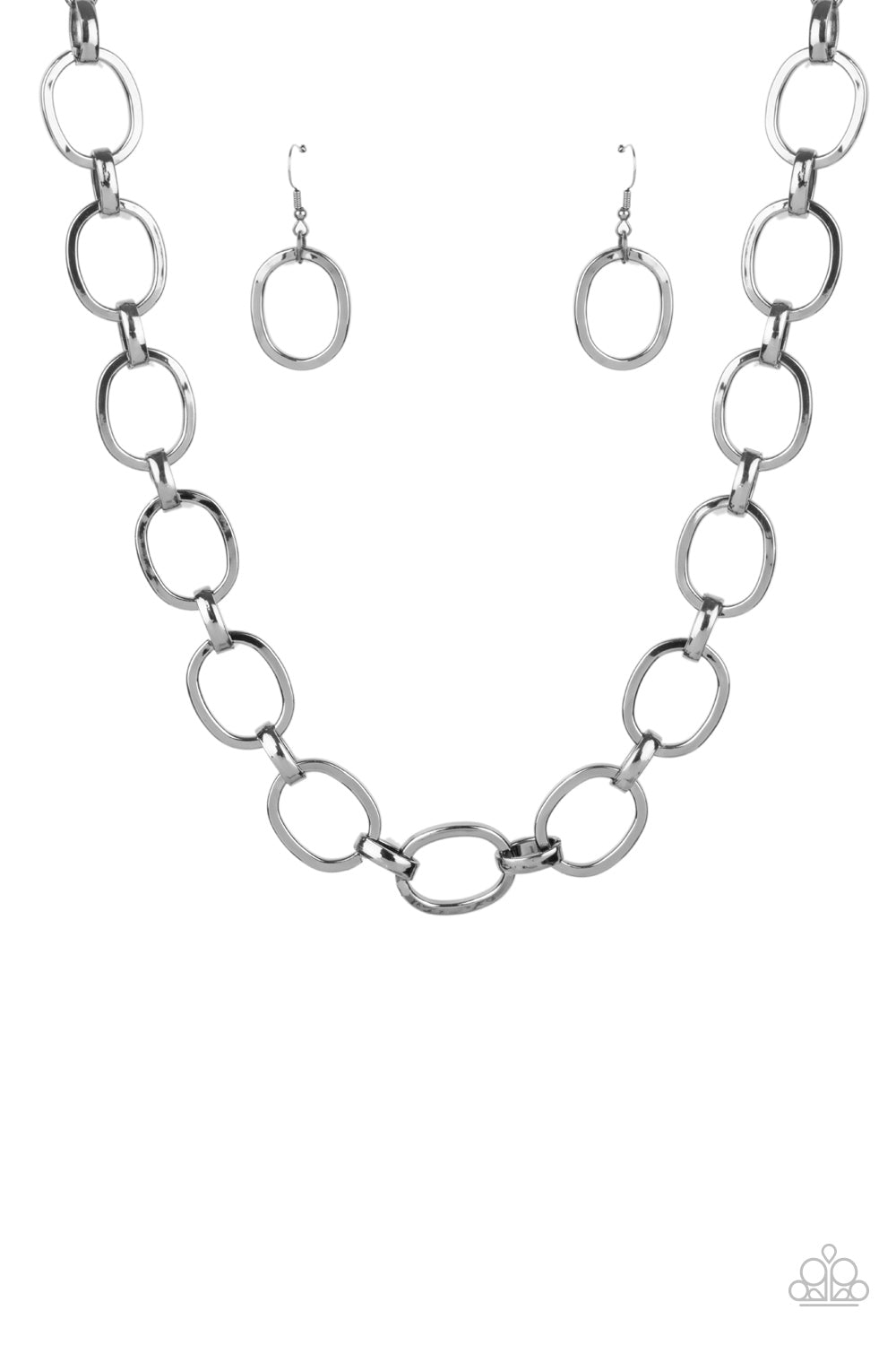 HAUTE-ly Contested Black Necklace - Paparazzi Accessories  A glistening series of dramatically oversized ovals and links boldly connect below the collar, creating an intense industrial statement. Features an adjustable clasp closure.  All Paparazzi Accessories are lead free and nickel free!   Sold as one individual necklace. Includes one pair of matching earrings.