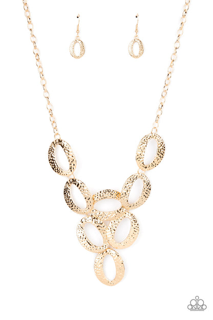 OVAL The Limit Gold Necklace - Paparazzi Accessories  Hammered in shimmery detail, oversized gold ovals delicately link into a dramatic centerpiece below the collar for a refined look. Features an adjustable clasp closure.  Sold as one individual necklace. Includes one pair of matching earrings.