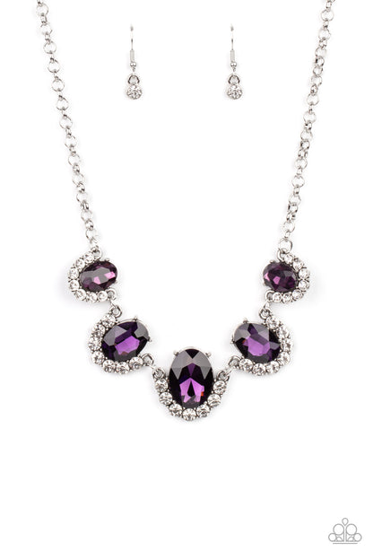 The Queen Demands It Purple Necklace - Paparazzi Accessories  Gradually increasing in size at the center, the sparkly bottoms of oversized purple gems are bordered in rows of glassy white rhinestones as they link below the collar for a dramatic effect. Features an adjustable clasp closure.  All Paparazzi Accessories are lead free and nickel free!  Sold as one individual necklace. Includes one pair of matching earrings.