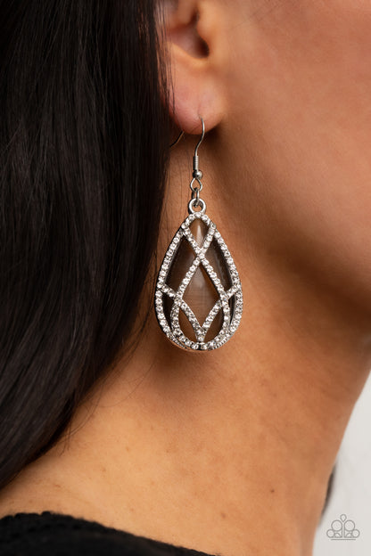 Crawling With Couture Brown Earring - Paparazzi Accessories  White rhinestone encrusted silver bars crisscross into a glittering beveled teardrop that delicately overlaps an oversized brown teardrop cat's eye stone, creating a luminously layered lure. Earring attaches to a standard fishhook fitting.  All Paparazzi Accessories are lead free and nickel free!  Sold as one pair of earrings.