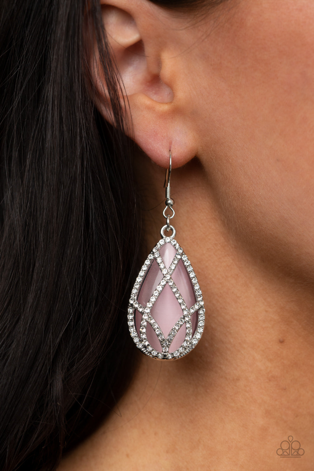 Crawling With Couture Pink Earring - Paparazzi Accessories. White rhinestone encrusted silver bars crisscross into a glittering beveled teardrop that delicately overlaps an oversized pink teardrop cat's eye stone, creating a luminously layered lure. Earring attaches to a standard fishhook fitting.  All Paparazzi Accessories are lead free and nickel free!  Sold as one pair of earrings.