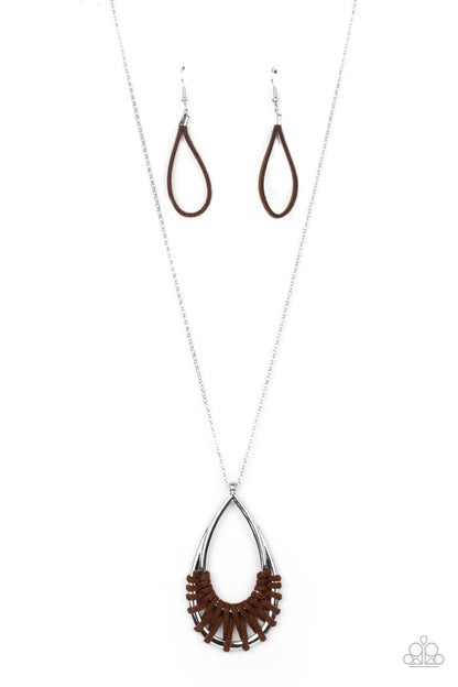 Homespun Artifact Brown Necklace - Paparazzi Accessories  Brown suede cording loops and weaves around the bottoms of a double stacked silver teardrop frame, creating an earthy pendant at the bottom of a dainty lengthened silver chain. Features an adjustable clasp closure.  Sold as one individual necklace. Includes one pair of matching earrings.