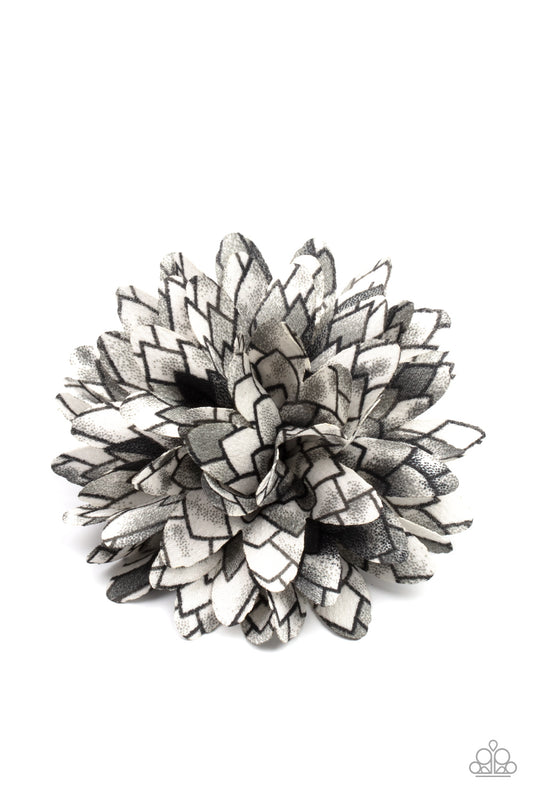 Vanguard Gardens Black Hair Clip - Paparazzi Accessories  Featuring gray accents, the petals of a bouncy blossom are printed in an abstract geometric pattern for an artsy look. Features a standard hair clip on the back.  ﻿All Paparazzi Accessories are lead free and nickel free!  Sold as one individual hair clip.