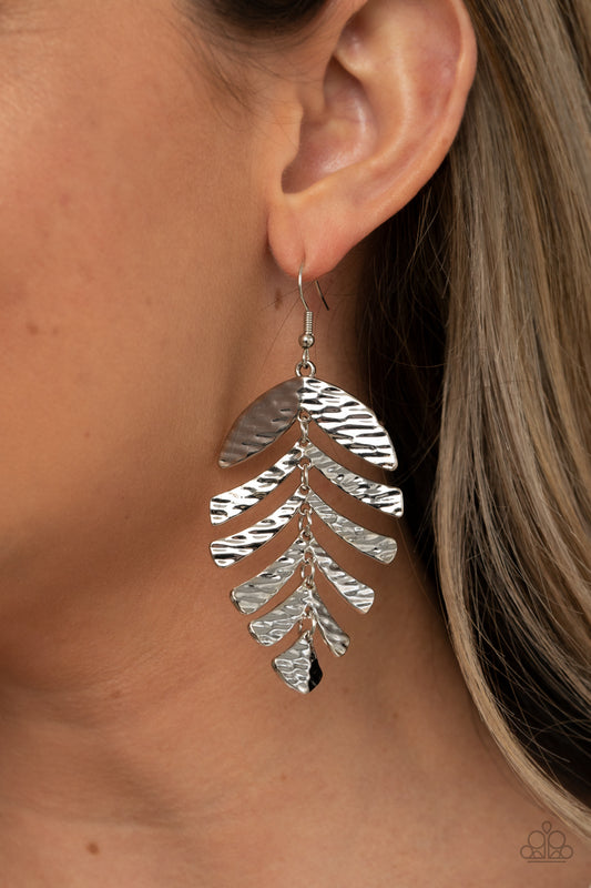 Palm Lagoon Silver Earring - Paparazzi Accessories  Rippling with tactile textures, dainty silver frames link into a dancing palm leaf for a simply seasonal fashion. Earring attaches to a standard fishhook fitting.  All Paparazzi Accessories are lead free and nickel free!  Sold as one pair of earrings.