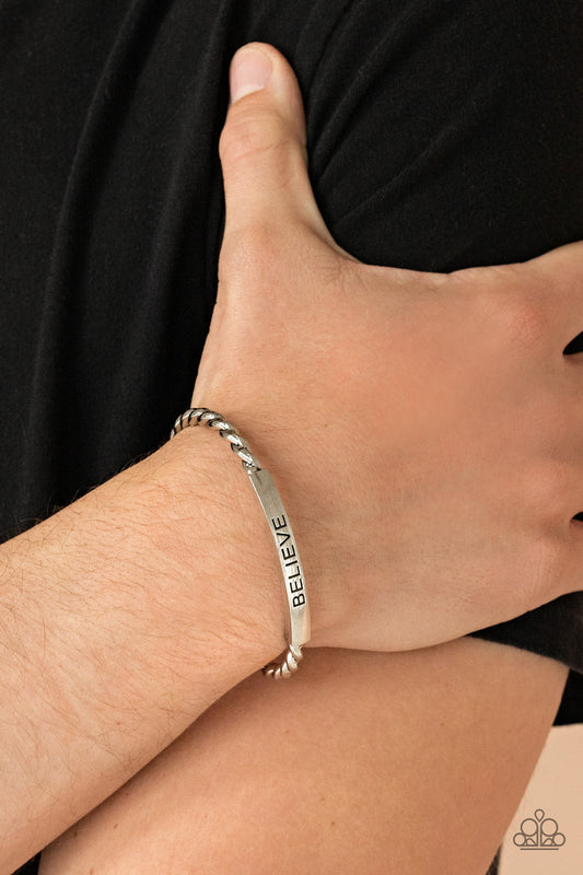 Keep Calm and Believe Silver Cuff Bracelet - Paparazzi Accessories  Twisted silver bars attach to a shiny silver plate stamped in the word, "BELIEVE," creating an inspiring cuff around the wrist.  Sold as one individual bracelet.