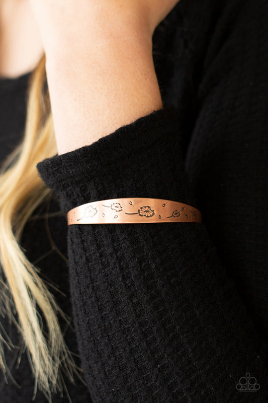 Dandelion Dreamland Copper Bangle Bracelet - Paparazzi Accessories  Flowery dandelion-like patterns are stamped across the front of an uneven copper bangle, creating a stackable seasonal display around the wrist.  ﻿All Paparazzi Accessories are lead free and nickel free!  Sold as one individual bracelet.