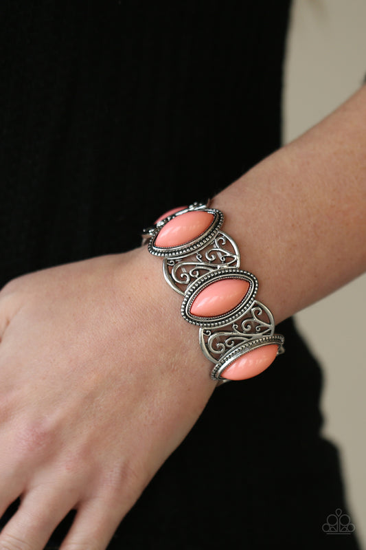 POP, Skip, and a Jump Orange Bracelet - Paparazzi Accessories  A whimsical collection of filigree filled silver frames and coral beaded frames are threaded along stretchy bands around the wrist, creating a flamboyant pop of color.  ﻿All Paparazzi Accessories are lead free and nickel free!  Sold as one individual bracelet.