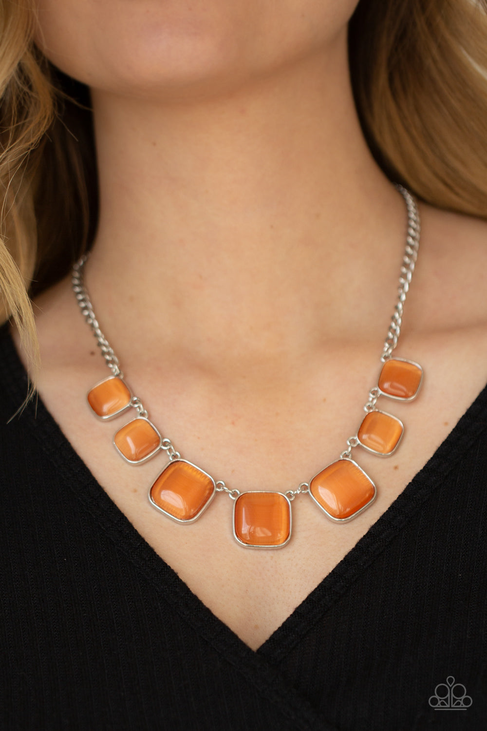 Aura Allure Orange Necklace - Paparazzi Accessories  Encased in square silver fittings, a dewy collection of orange cat's eye stones gradually increase in size as they link below the collar for a whimsical pop of color. Features an adjustable clasp closure.  ﻿All Paparazzi Accessories are lead free and nickel free!  Sold as one individual necklace. Includes one pair of matching earrings.