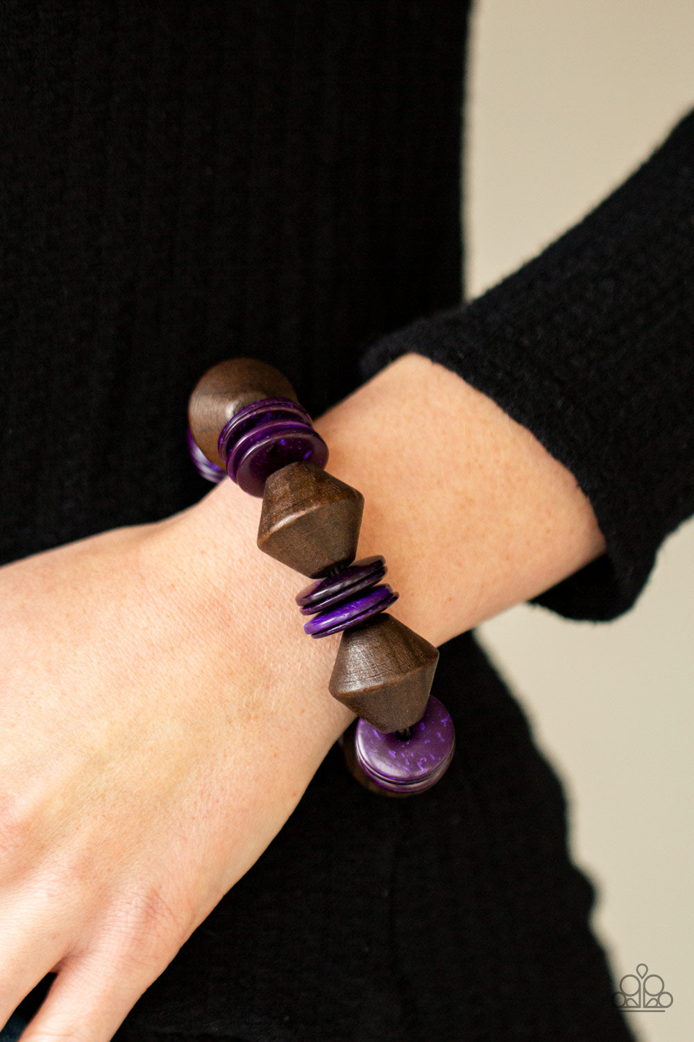 Bermuda Boardwalk Purple Wooden Bracelet - Paparazzi Accessories  Purple wooden discs and chunky brown wooden beads are threaded along a stretchy band around the wrist, creating a summery look.  All Paparazzi Accessories are lead free and nickel free!  Sold as one individual bracelet.