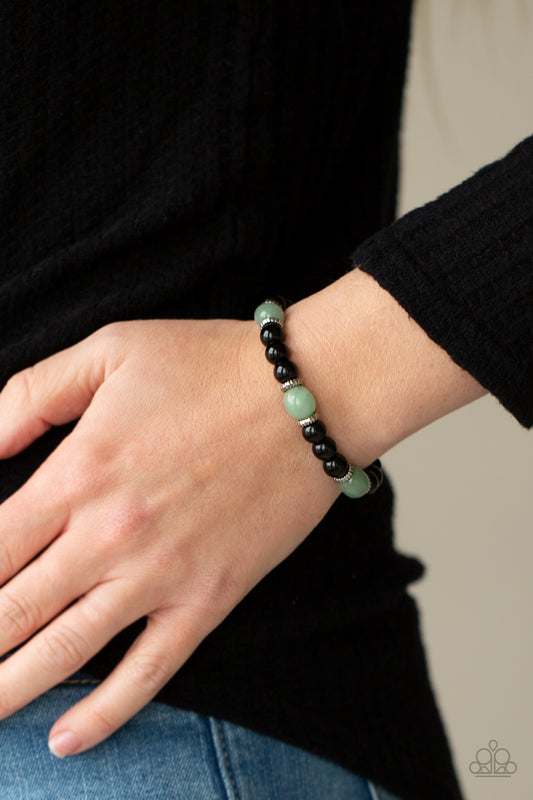 Unity Green Urban Bracelet - Paparazzi Accessories  Infused with dainty silver accents, glassy black and green stone beads are threaded along a stretchy band around the wrist for a stackable seasonal look.  All Paparazzi Accessories are lead free and nickel free!  Sold as one individual bracelet.