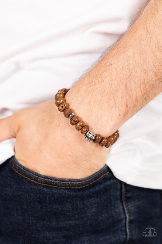 Natural State of Mind Brown Urban Bracelet - Paparazzi Accessories  Featuring a natural finish, a collection of faux brown stones are threaded along a stretchy band around the wrist. Shimmery silver accents are added to the earthy compilation for an artisan inspired finish.  Sold as one individual bracelet.