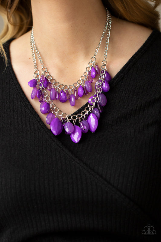 Midsummer Mixer Purple Necklace - Paparazzi Accessories. Varying in opacity, a vivacious collection of purple oval and teardrop acrylic and crystal-like beads cascade from two bold silver chains below the collar for a flirtatiously layered look. Features an adjustable clasp closure.  All Paparazzi Accessories are lead free and nickel free!  Sold as one individual necklace. Includes one pair of matching earrings.