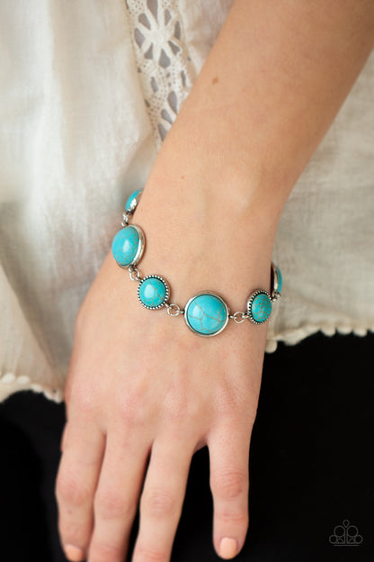 Turn Up The Terra Blue Bracelet - Paparazzi Accessories  Featuring studded and plain silver frames, small and large turquoise stones delicately alternate around the wrist for a rustic flair. Features an adjustable clasp closure.  All Paparazzi Accessories are lead free and nickel free!  Sold as one individual bracelet.  Get The Complete Look! Necklace: "Terrestrial Trailblazer - Blue" (Sold Separately)