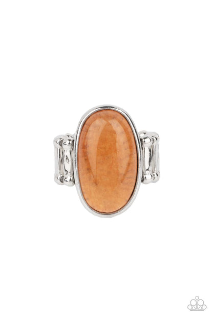 Mystical Mantra Orange Ring - Paparazzi Accessories  An oval orange stone is encased inside a sleek silver frame, creating a mystical centerpiece atop the finger. Features a stretchy band for a flexible fit. As the stone elements in this piece are natural, some color variation is normal.  Sold as one individual ring.