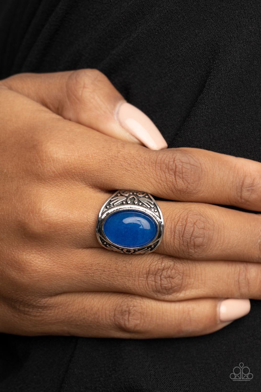 Sedona Dream Blue Ring - Paparazzi Accessories  An oversized lapis lazuli stone is pressed into the center of a thick silver frame embossed in antiqued tribal inspired patterns, creating an enchanting centerpiece atop the finger. Features a stretchy band for a flexible fit.  All Paparazzi Accessories are lead free and nickel free!  Sold as one individual ring.