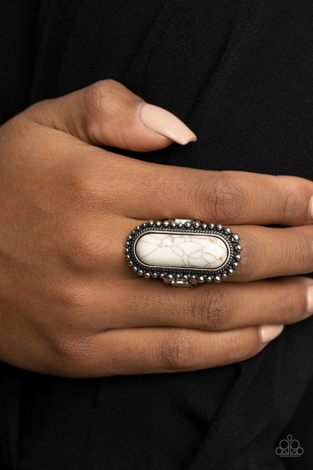 Sedona Scene White Ring - Paparazzi Accessories  An oblong white stone is nestled inside an oversized studded silver frame, creating a colorfully rustic centerpiece atop the finger. Features a stretchy band for a flexible fit.  All Paparazzi Accessories are lead free and nickel free!  Sold as one individual ring.