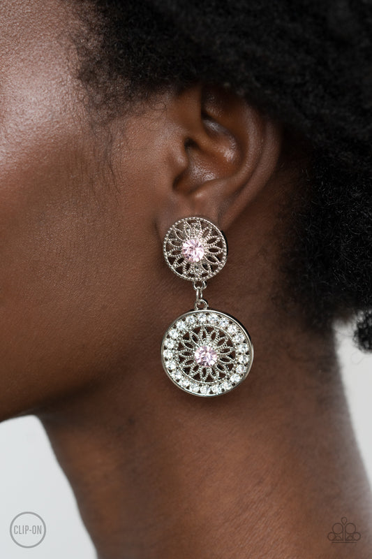 Life of The Garden Party Pink Clip-On Earring - Paparazzi Accessories  Dotted with glittery pink rhinestone centers, shimmery silver floral frames link into a whimsical lure. The lower frame is bordered in glassy white rhinestones for a timeless finish. Earring attaches to a standard clip-on fitting.  All Paparazzi Accessories are lead free and nickel free!  Sold as one pair of clip-on earrings.