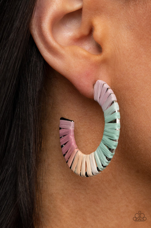 A Chance of RAINBOWS Multi Hoop Earring - Paparazzi Accessories. Multicolored wicker-like cording wraps around a thick silver hoop, creating a flirty pop of color. Earring attaches to a standard post fitting. Hoop measures approximately 1 1/2" in diameter.  All Paparazzi Accessories are lead free and nickel free!  Sold as one pair of hoop earrings.