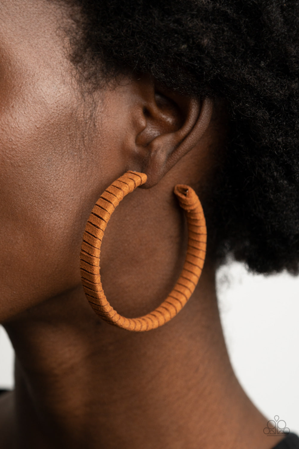 Suede Parade Brown Hoop Earring - Paparazzi Accessories  Tan suede cording wraps around an oversized hoop, creating an earthy pop of color. Earring attaches to a standard post fitting. Hoop measures approximately 2 1/4" in diameter.  All Paparazzi Accessories are lead free and nickel free!  Sold as one pair of hoop earrings.