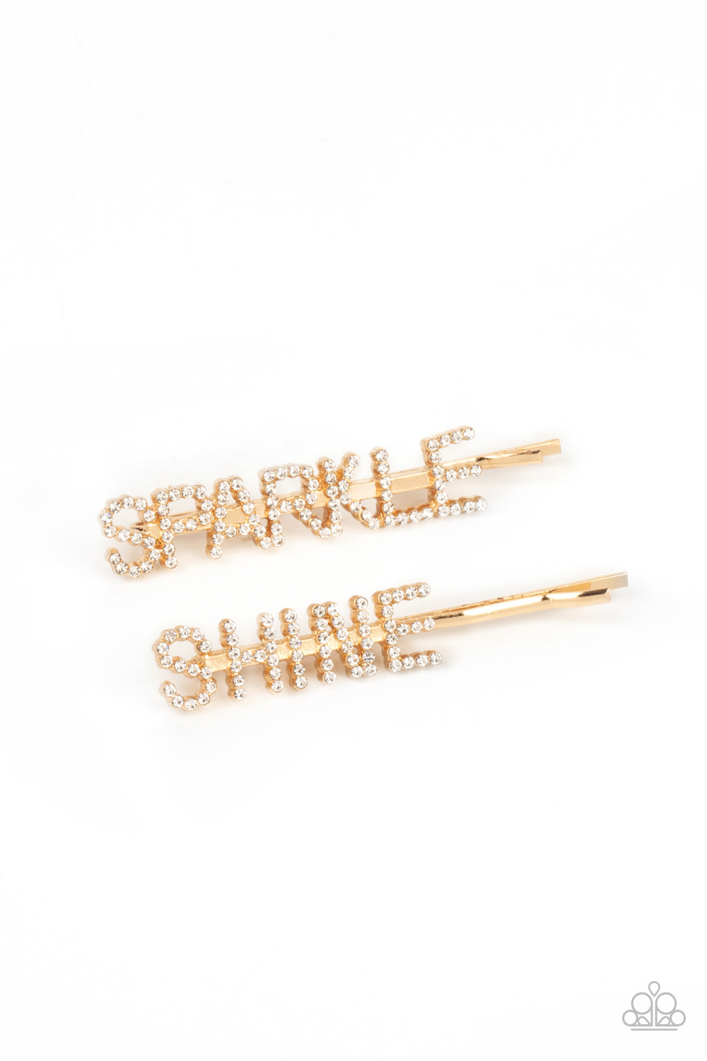 Center of the SPARKLE-verse Gold Hair Clip - Paparazzi Accessories  Glassy white rhinestones spell out "Sparkle," and "Shine," across the fronts of two gold bobby pins, creating a sparkly duo.  Sold as one pair of decorative bobby pins.