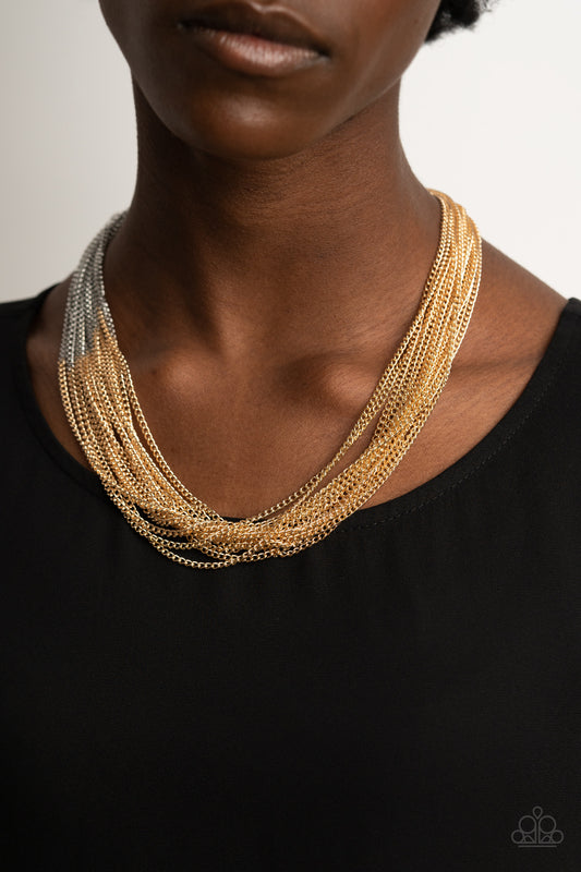 Metallic Merger Gold Necklace - Paparazzi Accessories  Sections of glistening gold chains collide with shimmery silver chains below the collar, linking into dramatic layers for an edgy effect. Features an adjustable clasp closure.  ﻿All Paparazzi Accessories are lead free and nickel free!  Sold as one individual necklace. Includes one pair of matching earrings.