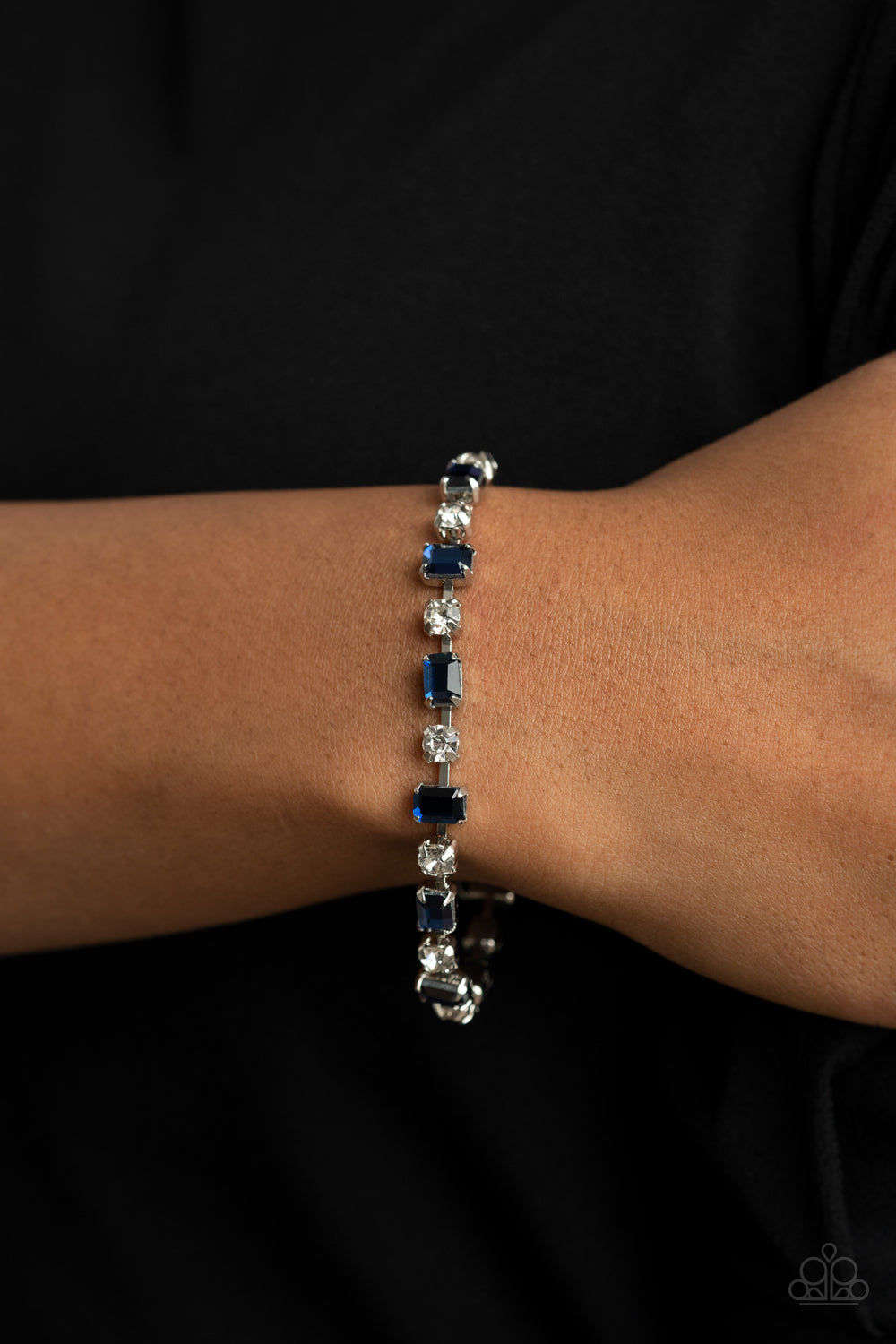 Out In Full FIERCE Blue Bracelet - Paparazzi Accessories  Featuring pronged silver fittings, emerald cut blue rhinestones alter in position as they alternate with classic white rhinestones around the wrist for a timeless look. Features an adjustable clasp closure.  All Paparazzi Accessories are lead free and nickel free!  Sold as one individual bracelet.