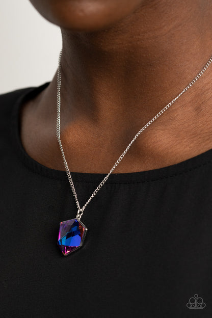 Stellar Serenity Purple Necklace - Paparazzi Accessories  Featuring a UV shimmer, a purple iridescent raw-cut gem dazzles below the collar, creating an out-of-this-world sparkle. Features an adjustable clasp closure.  All Paparazzi Accessories are lead free and nickel free!  Sold as one individual necklace. Includes one pair of matching earrings.