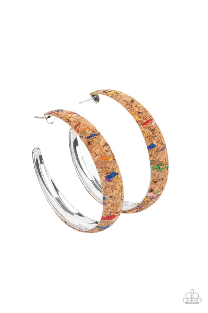 A CORK In The Road Multi Hoop Earring - Paparazzi Accessories  A cork lined silver hoop is splattered in multicolored paint, creating a colorful display. Hoop measures approximately 2" in diameter. Earring attaches to a standard post fitting.  Sold as one pair of hoop earrings.