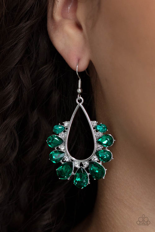 Two Can Play That Game Green Earring - Paparazzi Accessories  Gradually increasing in size, a glittery collection of green teardrop rhinestones fan out from a white rhinestone dotted silver teardrop frame, creating a sparkly statement. Earring attaches to a standard fishhook fitting.  All Paparazzi Accessories are lead free and nickel free!  Sold as one pair of earrings.